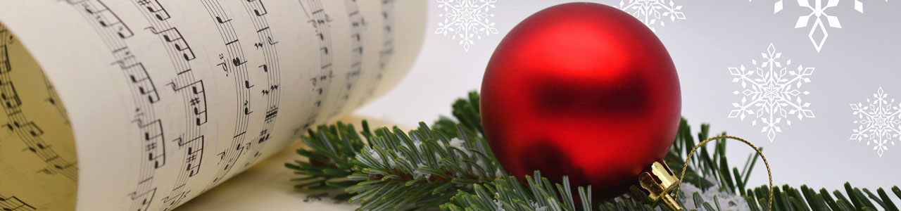 Christmas ornament sits on a musical score